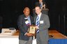ISBA President Roderick H. Morgan (left) honors the second-place recipient of the Harrison Legal Writing Award, Howard L. Huntington, on October 14, 2010.
