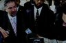 Left to right: Rob Serafinowicz and Officer Mustafa Salahuddin address the media in July 2008 after Salahuddin's arraignment on the charge of larceny stemming from an allegation he took a garden hose from his employer, the Ansonia Police Department.
