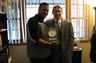 Attorney Smith with Mr. Carlos Gonzalez-Megret, a client who was acquitted of all charges.  Mr. Gonzalez-Megret is presenting Attorney Smith with a specially engraved clock commemorating their victory.  They remain in touch to this day.