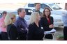 Julie Naegelen of the Carteret County Chamber of Commerce with attorney Sharon Scudder and family and friends outside of the ribbon cutting.