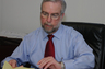 Ralph B. Hill, III, Esquire at his desk at the Law Offices of Pinizzotto~Hill, L.L.C.