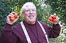 During a trip to Israel, Alan picks fruit for the poor in Rehovot under the direction of a program known as "Table to Table".