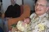 Gerry Elman holding his grandson Elijah, along with Elijah's other grandfather, Harjeet Singh.