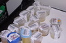 Crime laboratory urine samples with bar codes attached, ready for analysis for contraband drugs.  When hand-written tracking to logs is attempted, the chance for error is apparent. This small vial can be the source of 20 years in prison if in error.