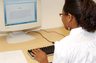Intern Kaylah Woodword from Northwest High School working on a memorandum.