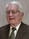 Brian L Comstock